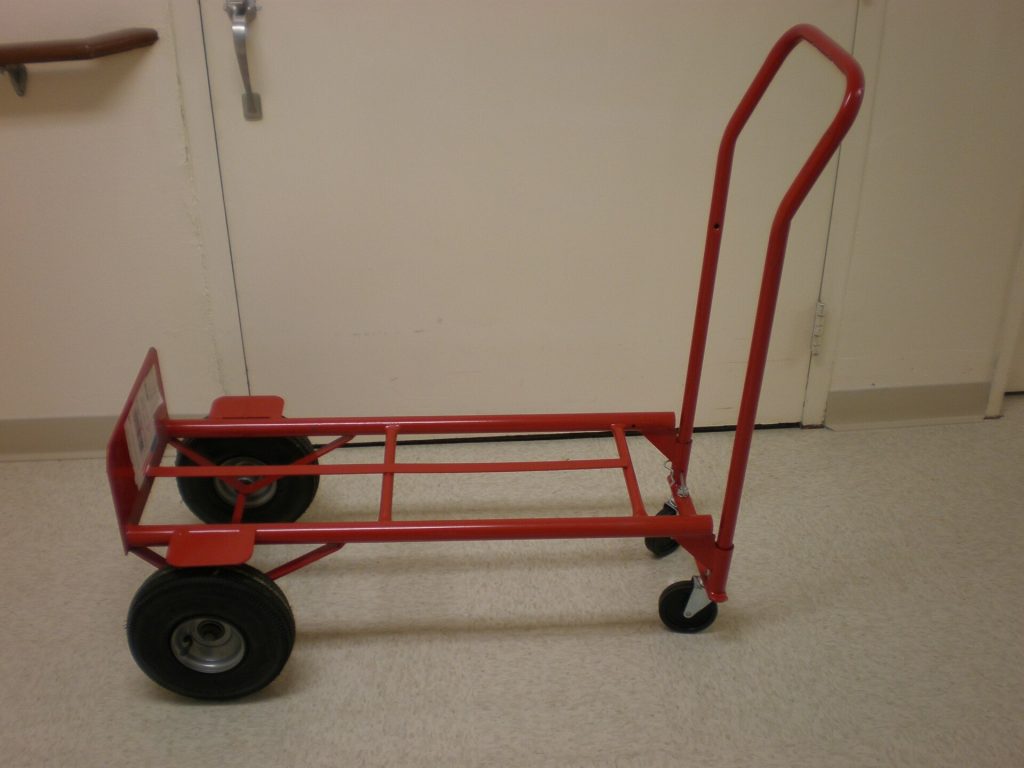 Red hand truck on 4 wheels side