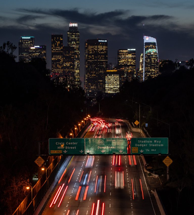 The downtown Los Angeles skyline at night (general view of DTLA; not a photo of Olympic + Hill)