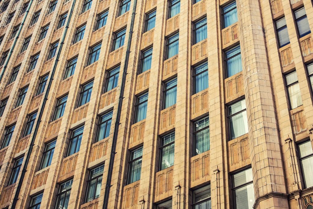 Brown apartment building (Unsplash)