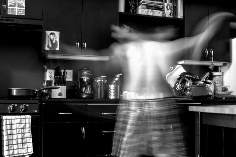 Man in kitchen in motion (Unsplash)