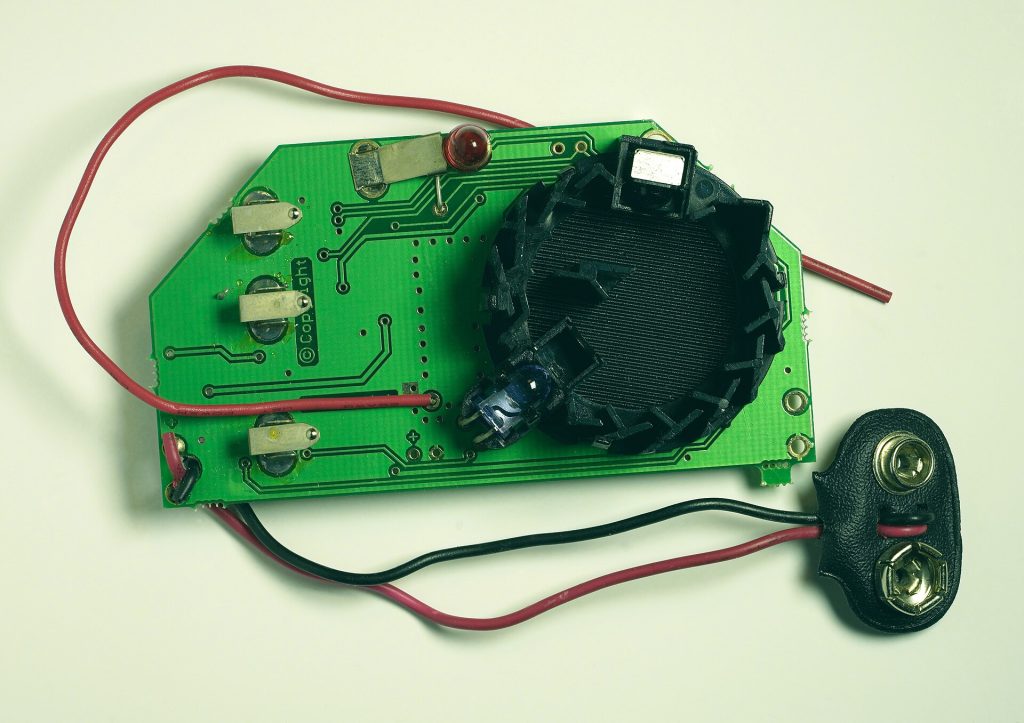 Smoke sensor - detector chamber open displaying transmitter and detector